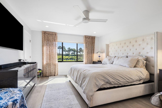 bedroom featuring ceiling fan, wood finished floors, and recessed lighting