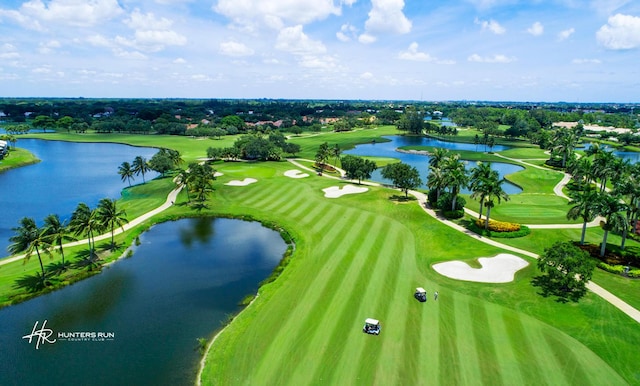 bird's eye view featuring view of golf course and a water view