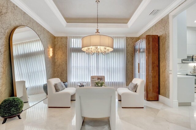 living area featuring visible vents, wallpapered walls, a tray ceiling, and ornamental molding