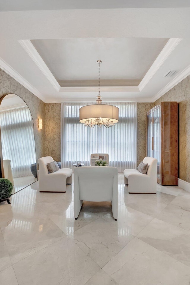 living room with a tray ceiling, crown molding, and visible vents