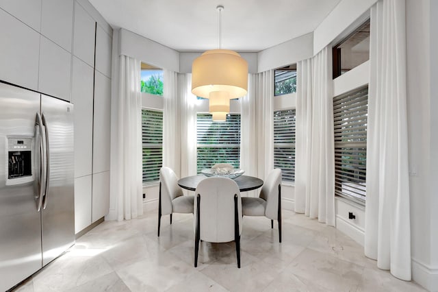 dining space featuring a wealth of natural light