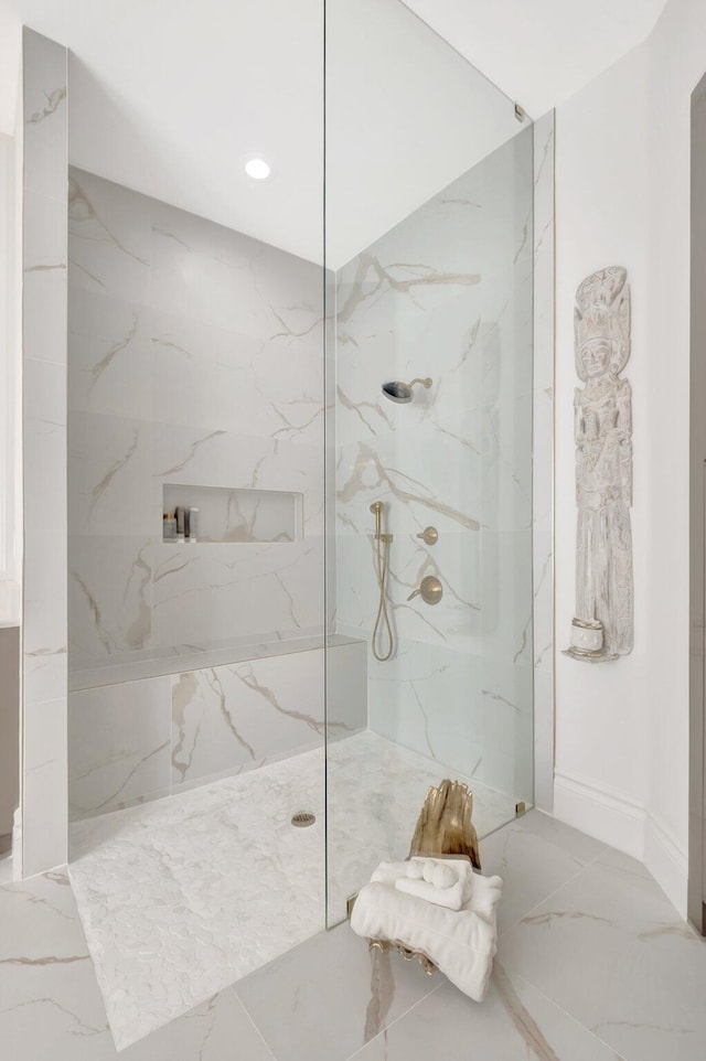 full bath featuring recessed lighting, a marble finish shower, and marble finish floor