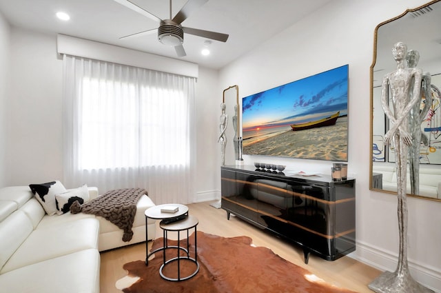 living room with recessed lighting, baseboards, ceiling fan, and wood finished floors