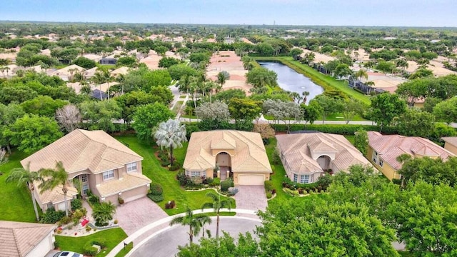 bird's eye view with a residential view and a water view