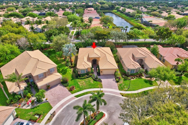 birds eye view of property featuring a residential view and a water view