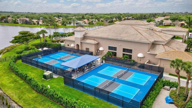 birds eye view of property with a water view