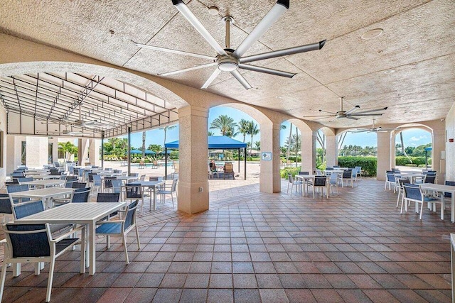 view of patio / terrace featuring outdoor dining space and ceiling fan