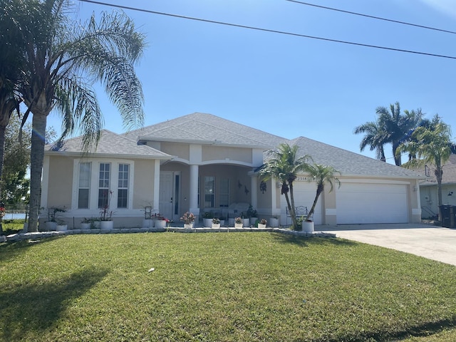 ranch-style house featuring stucco siding, a front lawn, concrete driveway, and a garage