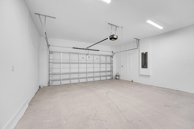 garage with electric panel and a garage door opener