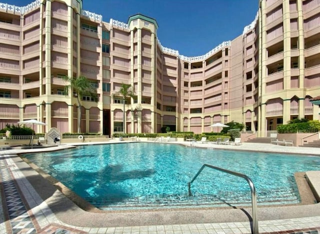 community pool featuring a patio area