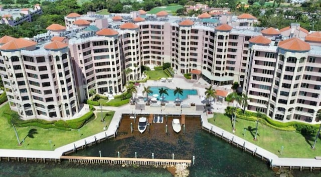 birds eye view of property with a water view