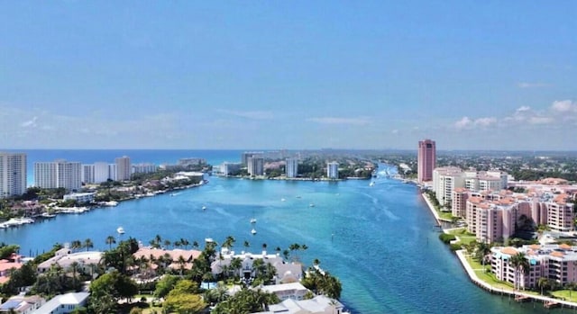 drone / aerial view with a view of city and a water view