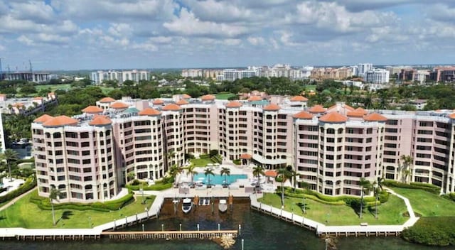 birds eye view of property featuring a view of city and a water view