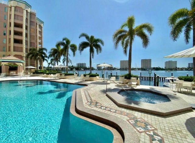 community pool featuring a community hot tub, a patio area, and a gazebo