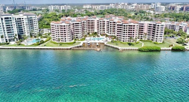 drone / aerial view with a view of city and a water view