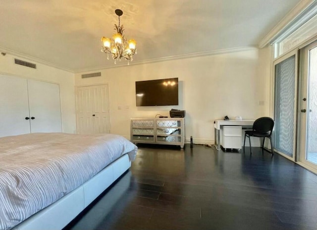 bedroom with ornamental molding, a chandelier, visible vents, and wood finished floors