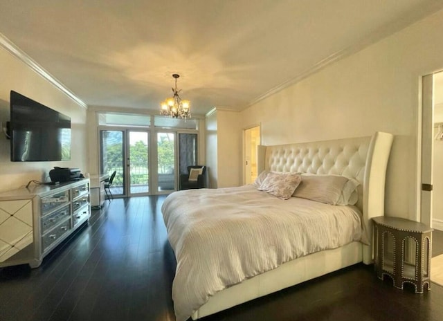 bedroom with a notable chandelier, dark wood-type flooring, access to exterior, french doors, and ornamental molding