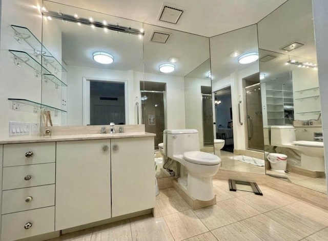 full bathroom featuring toilet, a stall shower, and vanity