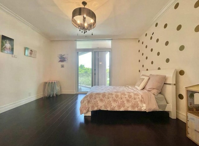 bedroom featuring access to exterior, a notable chandelier, dark wood-type flooring, ornamental molding, and baseboards