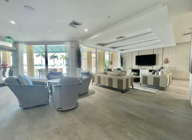 interior space with recessed lighting, visible vents, and wood finished floors