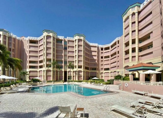 community pool featuring a patio area