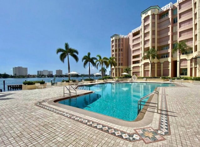 pool featuring a patio area and a city view