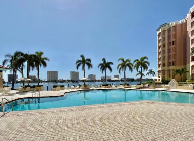 pool featuring a city view and a patio