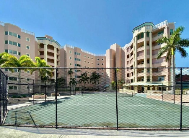 view of sport court with fence