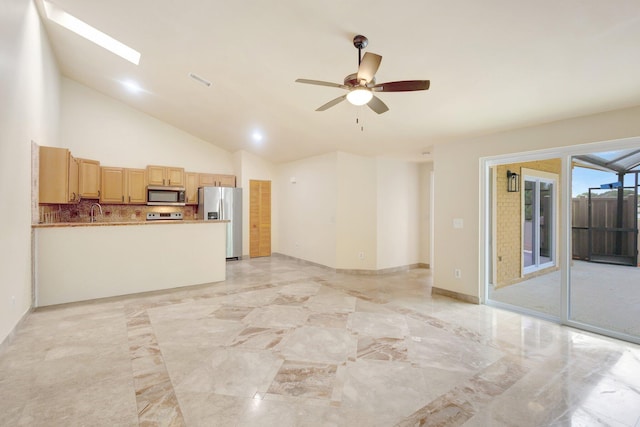 unfurnished living room with high vaulted ceiling, a skylight, a ceiling fan, baseboards, and marble finish floor