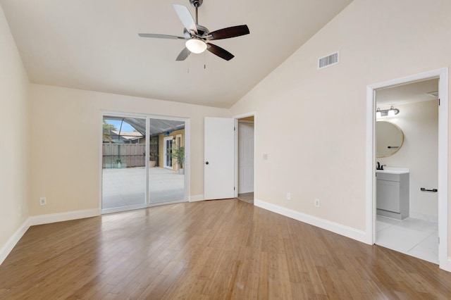 unfurnished bedroom with access to exterior, visible vents, ensuite bathroom, light wood-style floors, and baseboards