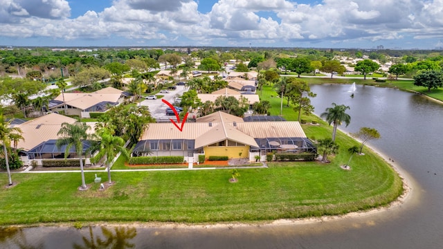 drone / aerial view with a water view and a residential view