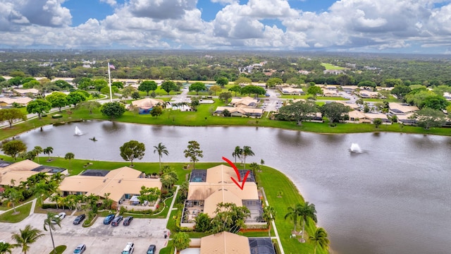 bird's eye view featuring a water view and a residential view