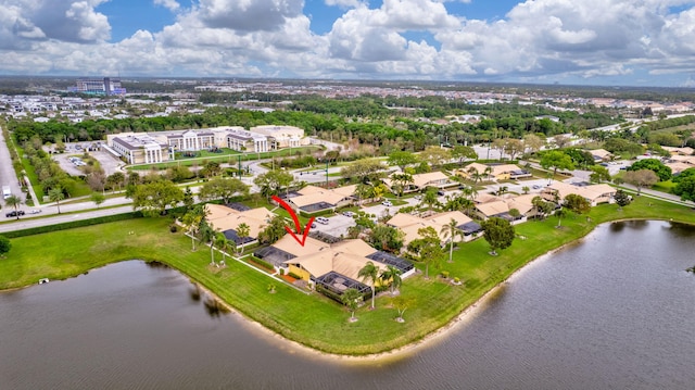 birds eye view of property with a water view