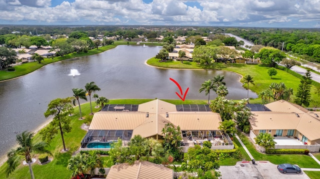 drone / aerial view featuring a water view and a residential view