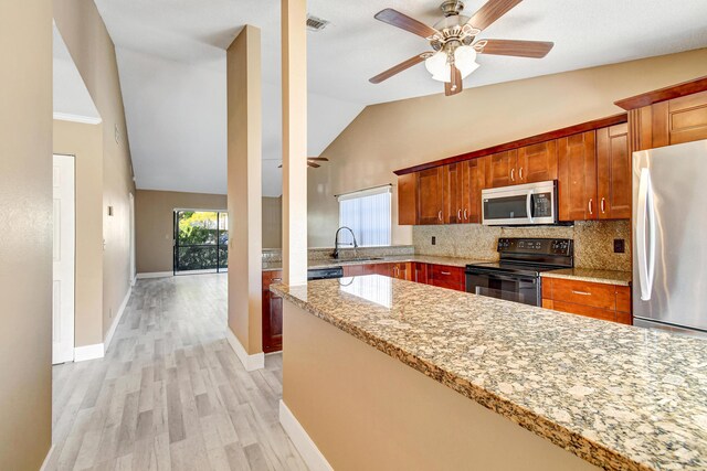 kitchen with range with electric stovetop, tasteful backsplash, a sink, black microwave, and dishwasher