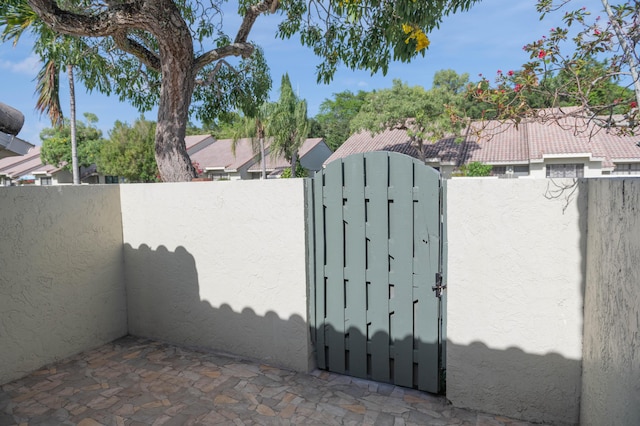 view of gate with fence