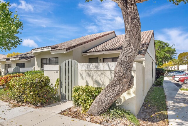 property entrance with stucco siding