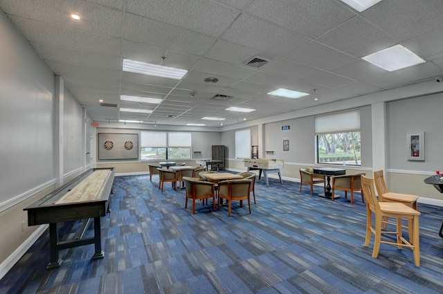 interior space featuring visible vents, baseboards, and dark carpet