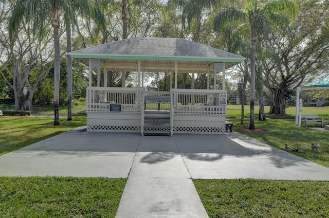 352 Richmond F 352, Deerfield Beach, FL 33442 - view of property's community featuring a gazebo, a lawn, driveway, and a wooden deck