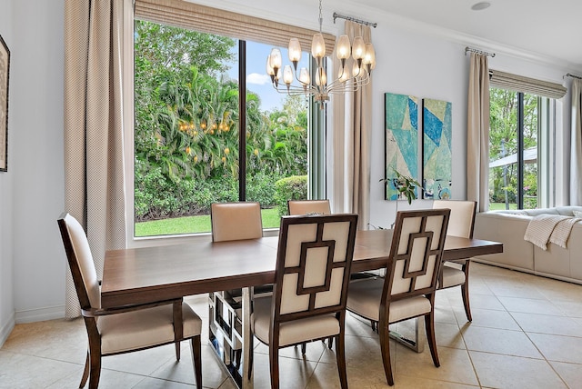 dining space featuring a chandelier, light tile patterned flooring, and crown molding