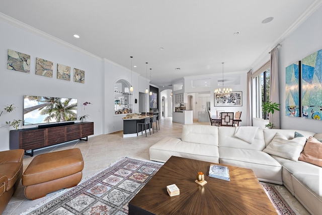 living room with a chandelier, recessed lighting, crown molding, and light tile patterned floors