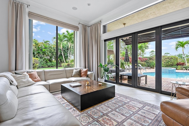 living area with light tile patterned floors and french doors