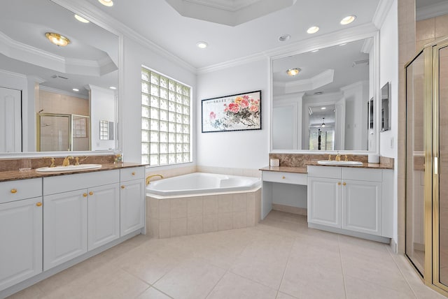 bathroom featuring ornamental molding, a sink, and a shower stall