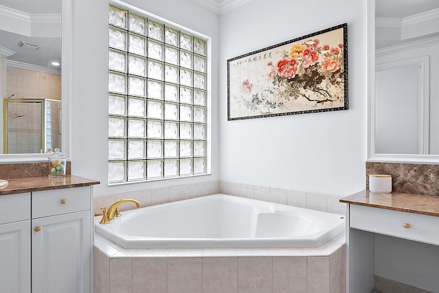 full bath featuring a garden tub, a shower stall, crown molding, and vanity