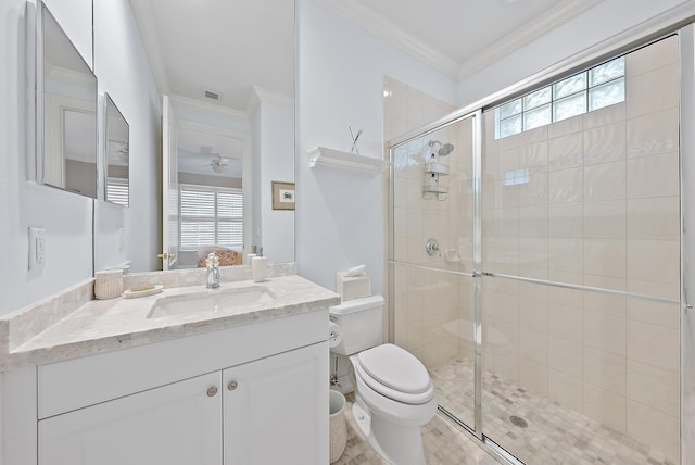 bathroom with a healthy amount of sunlight, a stall shower, toilet, and crown molding