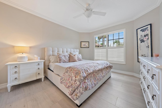 bedroom with ornamental molding, light wood finished floors, a ceiling fan, and baseboards