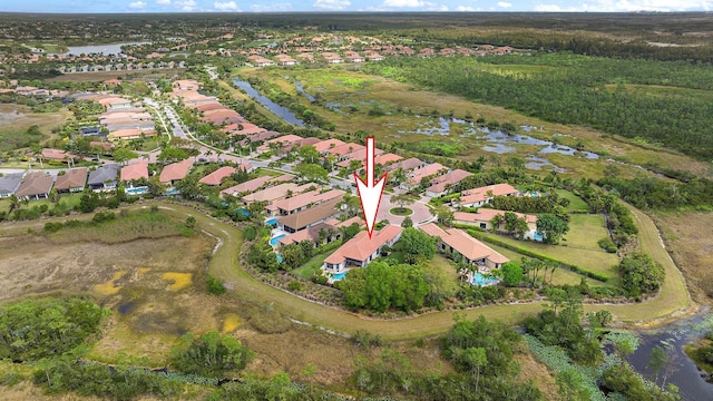 aerial view featuring a water view and a residential view