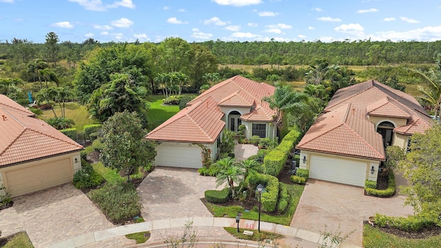 drone / aerial view with a view of trees