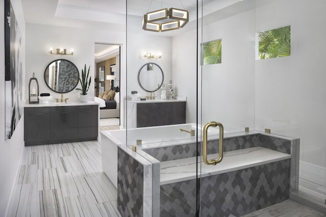 full bathroom with two vanities, a sink, a bath, and a shower stall