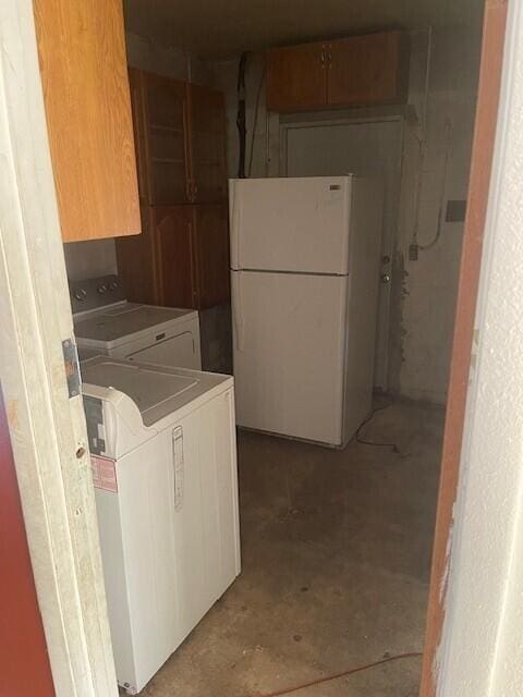 laundry room with cabinet space and separate washer and dryer